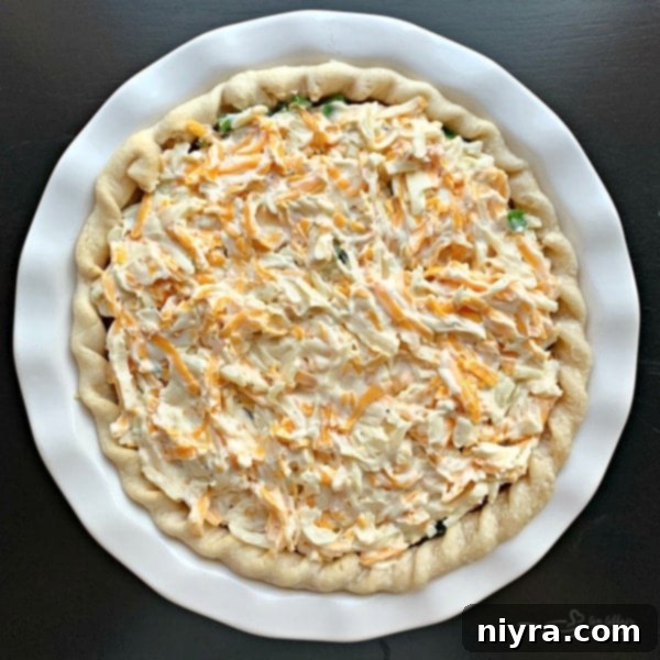 Tomato Pie with its cheesy mayonnaise topping spread evenly