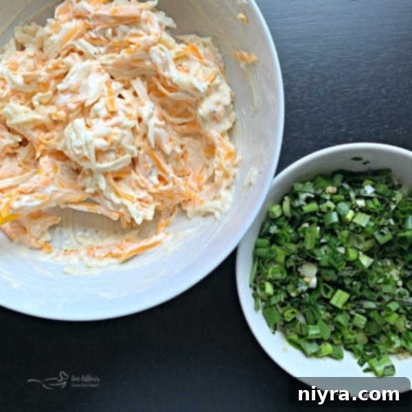 Ingredients prepped for tomato pie: chopped green onion, garlic, basil, and mixed cheese with mayonnaise