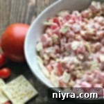 Close up of Tomato Cracker Salad in a white bowl