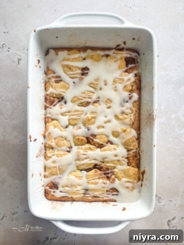 Iced Snickerdoodle Bars with glaze, sliced and ready to be served.