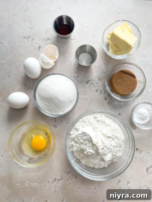 Stacked Iced Snickerdoodle Bars on a cooling rack, showing off their cinnamon-sugar topping and vanilla glaze.