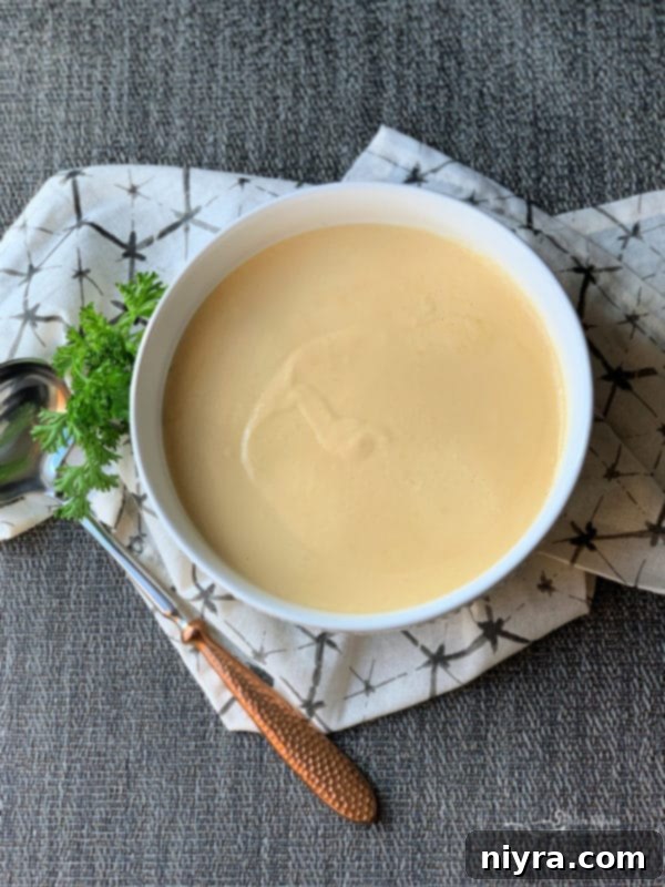 Crafted Beer Cheese Pasta 4 A bowl of freshly made, creamy Beer Cheese Pasta Sauce, ready to be poured over your favorite pasta or used as a versatile dipping sauce.