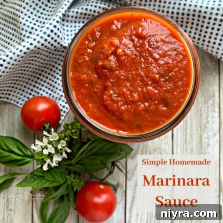 A large pot of freshly made Homemade Marinara Sauce, garnished with basil leaves and ready to be served