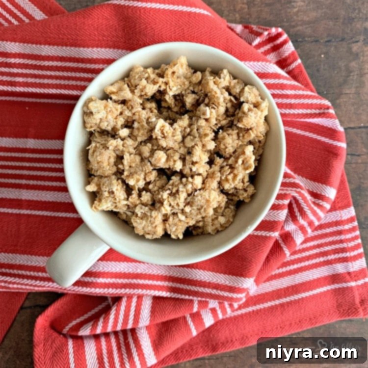 Add topping to mug on top of apples