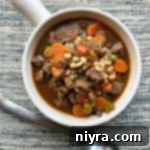 overhead of Instant Pot Vegetable Beef Soup in a white mug