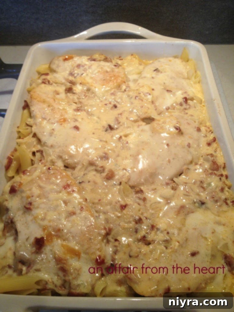 Creamy Baked Chicken Pasta with Bacon, hot out of the oven, golden and bubbly.
