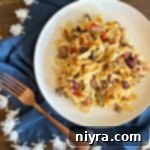 Overhead of Five Bean Ground Beef & Noodle Skillet Casserole on a white plate