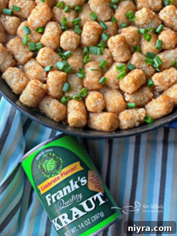 Hearty Beef and Sauerkraut Tater Tot Casserole 11 Frank's Kraut Tater Tot Skillet Casserole, a finished dish in a cast iron skillet.