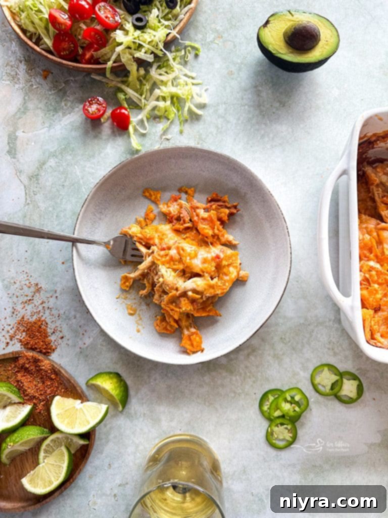 Close-up of a serving of Chicken and Doritos Casserole with layers clearly visible.