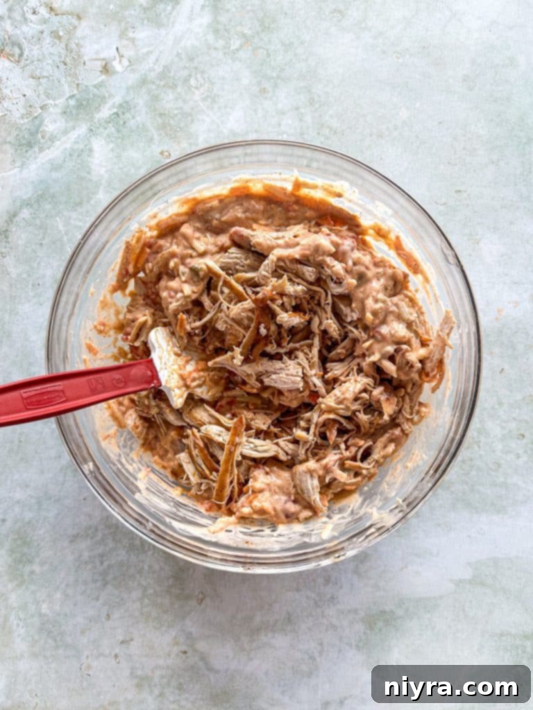 Creamy casserole sauce ingredients mixed in a large bowl.