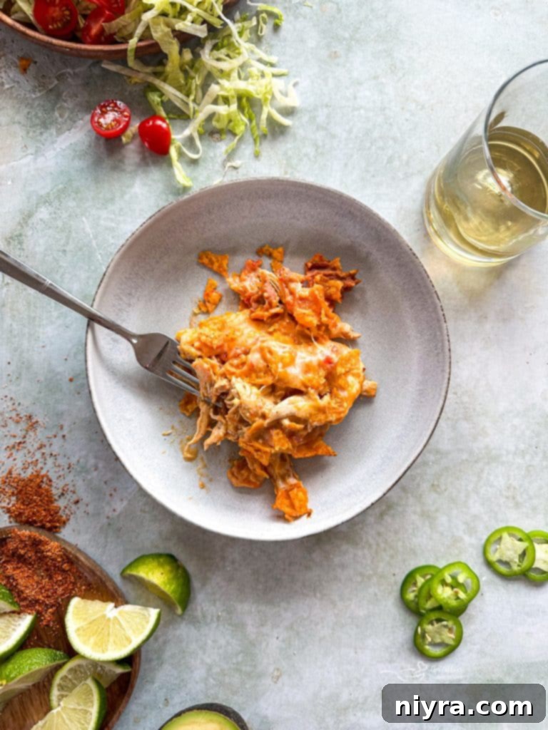 Close-up of a serving of Chicken and Doritos Casserole, showcasing the golden-brown crust.
