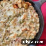 Cheesy Brussels Sprouts Dip in a skillet