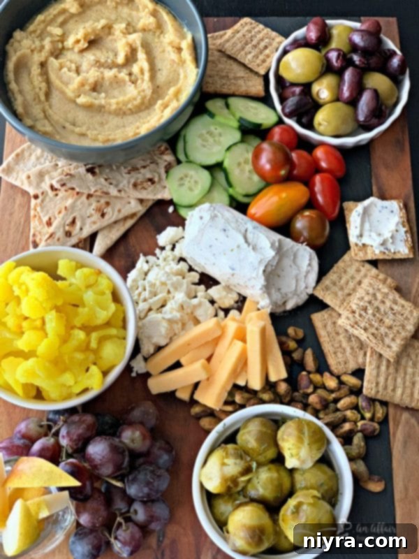 A visually appealing Mediterranean Inspired Cheeseboard featuring hummus and Paisley Farm Brussels Sprouts, perfect for entertaining
