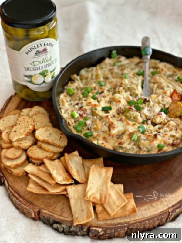 Cheesy Brussels Sprouts Dip showcasing Paisley Farm Dilled Brussels Sprouts, served hot and bubbly