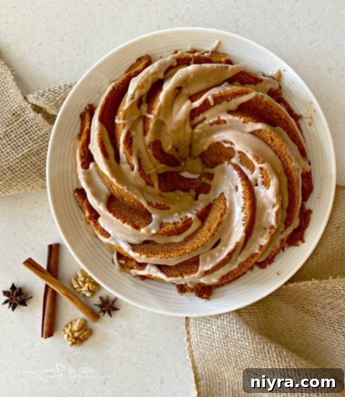 Overhead view of a beautiful Cinnamon Spice Coffee Cake, with a perfect spiced glaze