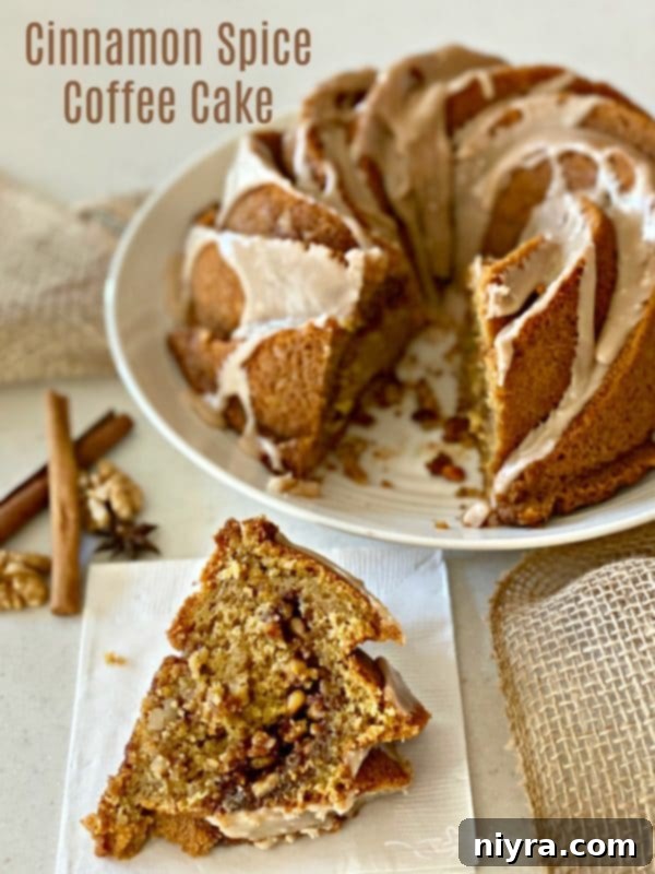 A stunning hero shot of a full Cinnamon Spice Coffee Cake, elegantly glazed