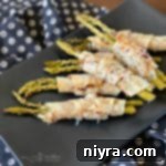 Close up of Bacon & Cheese Phyllo Wrapped Pickled Asparagus sq