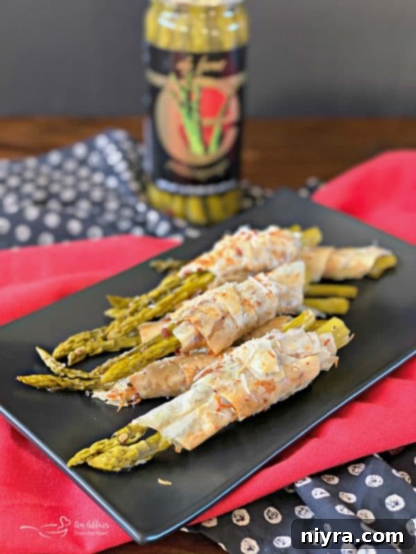 Bacon & Cheese Phyllo Wrapped Pickled Asparagus with Ely Farms branding