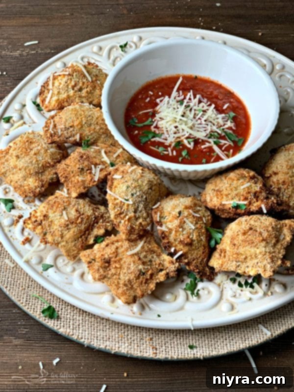 Golden-brown toasted ravioli, perfectly crispy from the air fryer, served in a bowl.