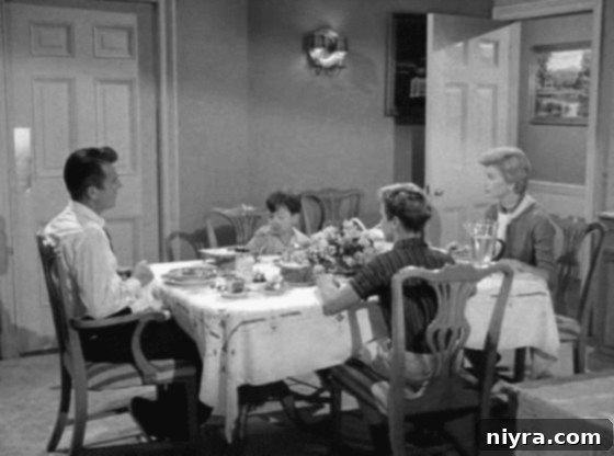 The Cleaver Family around their dinner table.