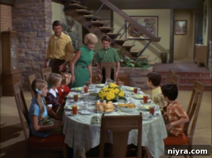 The Brady Bunch family enjoying a meal together.