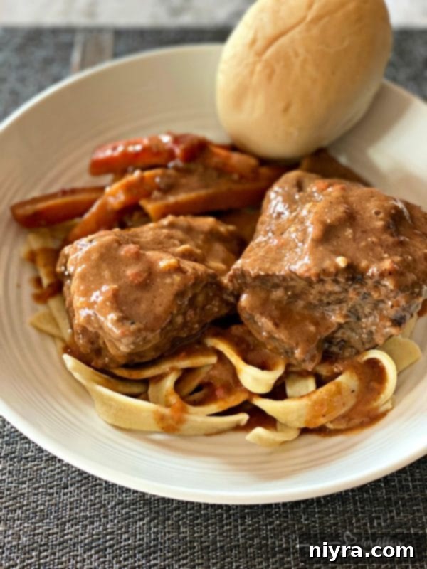 Braised Beef Short Ribs with Red Eye Gravy served with a crusty roll