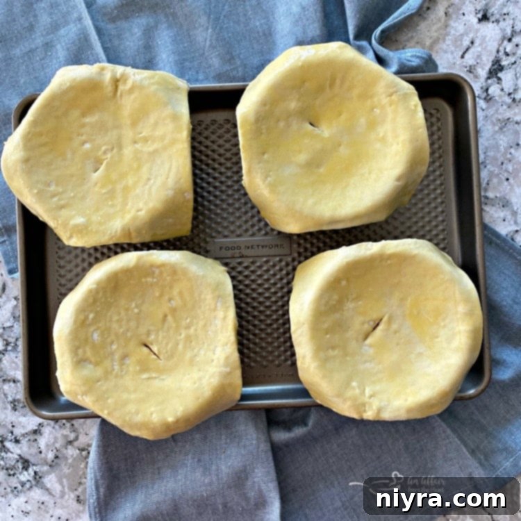 The Ultimate Reuben Pot Pie 10 Reuben Pot Pies topped with puff pastry, ready for baking