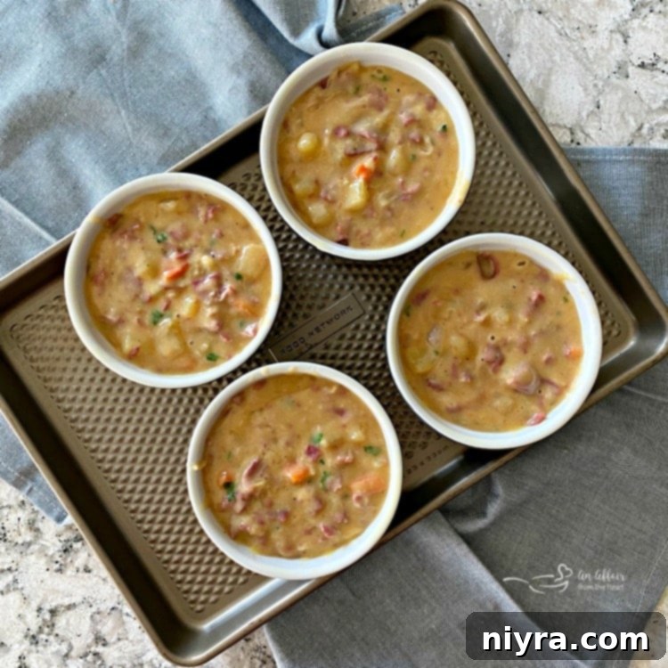 The Ultimate Reuben Pot Pie 8 Filling ramekins with hot Reuben Pot Pie mixture