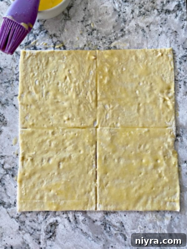 The Ultimate Reuben Pot Pie 9 Puff pastry squares prepared for topping Reuben Pot Pies