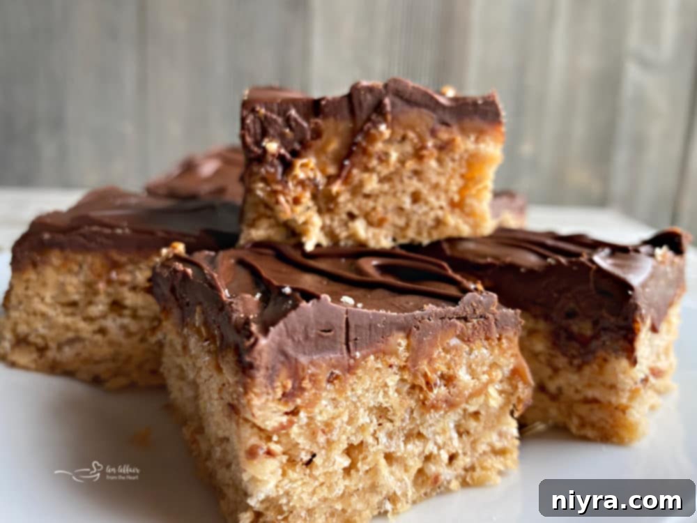 Close-up of a perfectly cut Homemade Whatchamacallit Bar revealing all layers