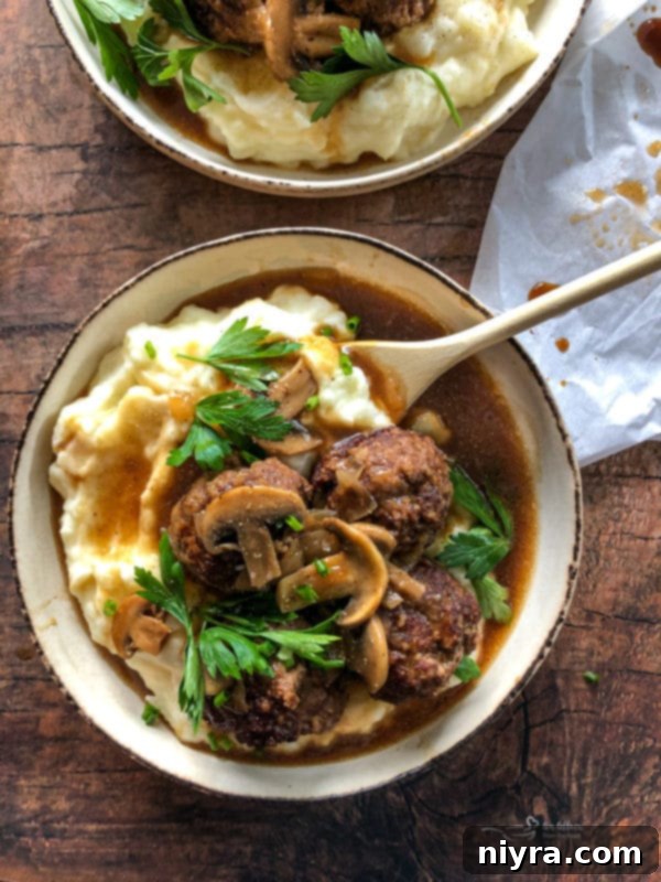 Salisbury Meatballs 5 Salisbury Steak Meatballs cooking in gravy