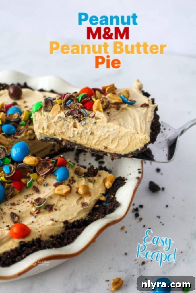 Ultimate Peanut M and M Peanut Butter Pie 16 A vibrant close-up of a slice of Peanut M&M Peanut Butter Pie, showing the filling and crust