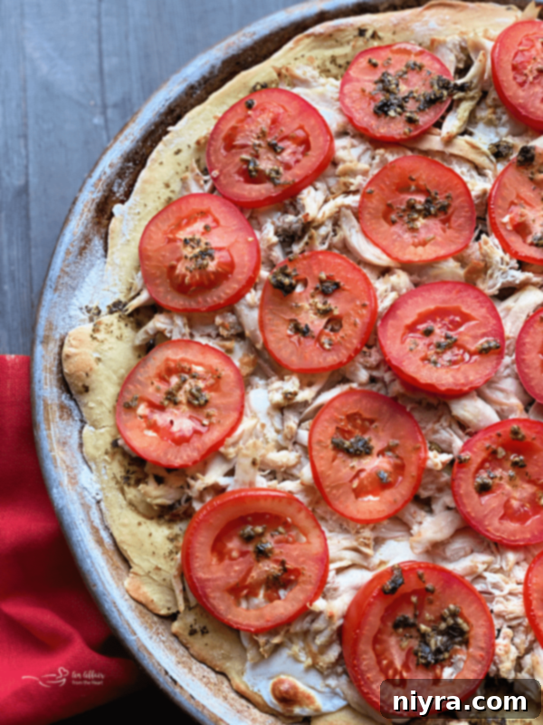 Flavorful Chicken Pesto Pizza 2 Delicious Five-Ingredient Chicken Pesto Pizza with fresh tomatoes