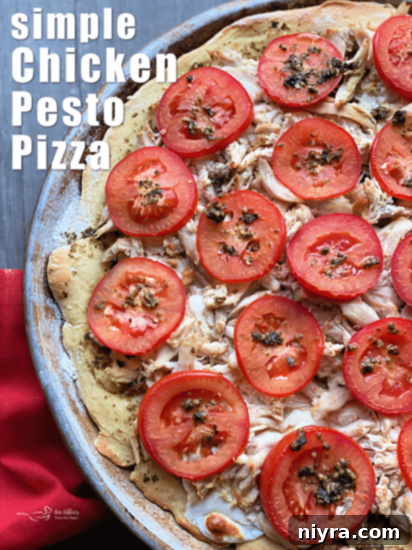 Flavorful Chicken Pesto Pizza 8 Chicken Pesto Pizza hero shot with fresh basil garnish