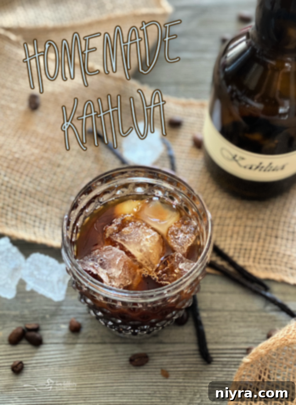 A clear bottle of homemade Kahlua with a simple label, against a light background.