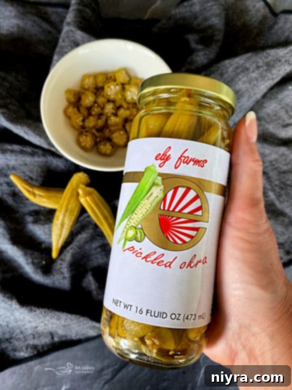 Zesty Okra Relish 3 Jars of Ely Farms Pickled Okra on a wooden board