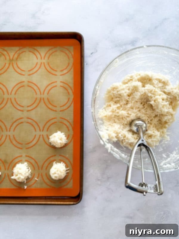 Mixing egg whites and vanilla in a separate bowl until stiff peaks form