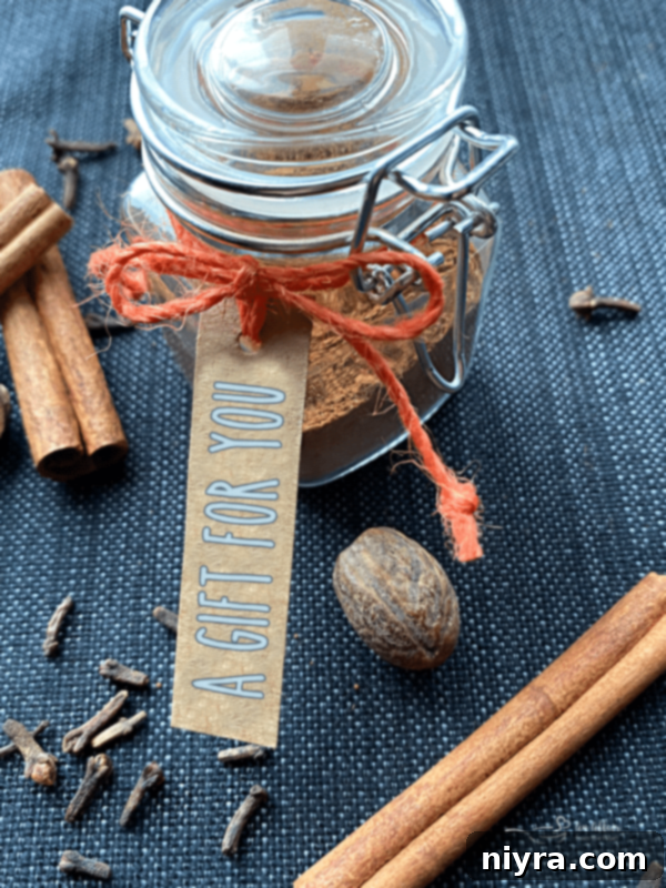 Artisan Pumpkin Pie Spice Mix 3 A collection of small spice jars with handwritten labels, suggesting they contain homemade spice blends.