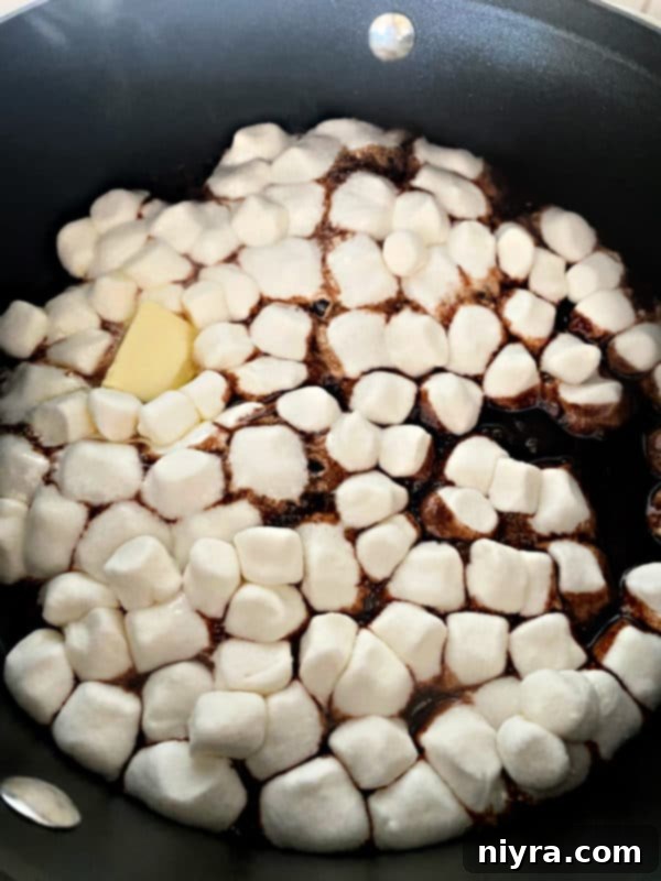 Smooth, melted marshmallow and chocolate mixture in saucepan