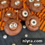 Halloween Chocolate Sugar cookies on orange and black towel with eyes