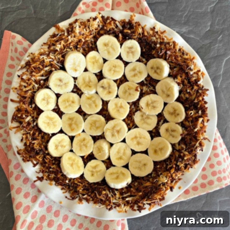 Banana slices arranged in a coconut pie crust