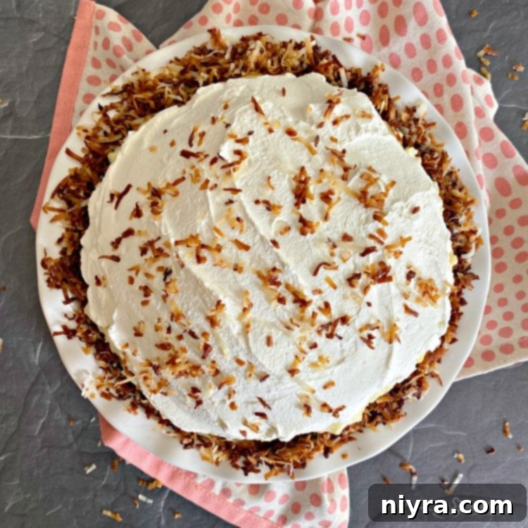 Cream Pie topped with whipped cream and toasted coconut