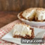 sliced Coconut Banana Cream Pie on a white plate