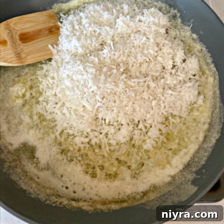 Melt butter in a skillet with shredded sweetened coconut