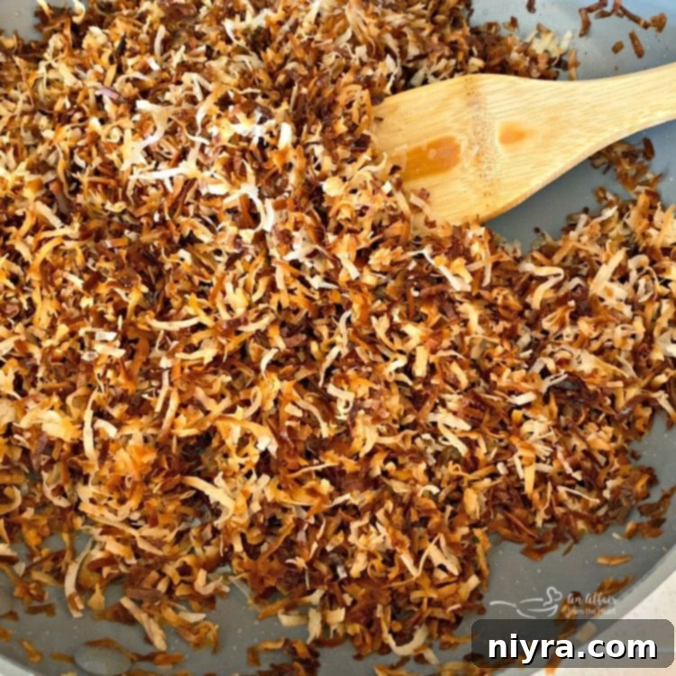 Toasted golden coconut in a skillet