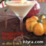 Side view of Pumpkin Pie Martini on a table with a mini pumpkin and text "pumpkin pie martini"