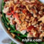 Gourmet Green Bean Gratin 10 From Scratch Green Bean Casserole close up in white casserole dish