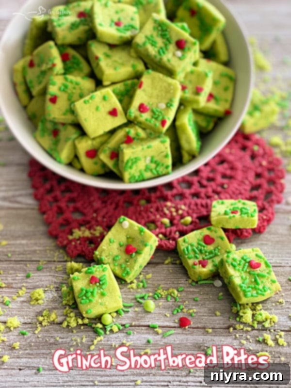 Grinch Shortbread Bites on a red plate