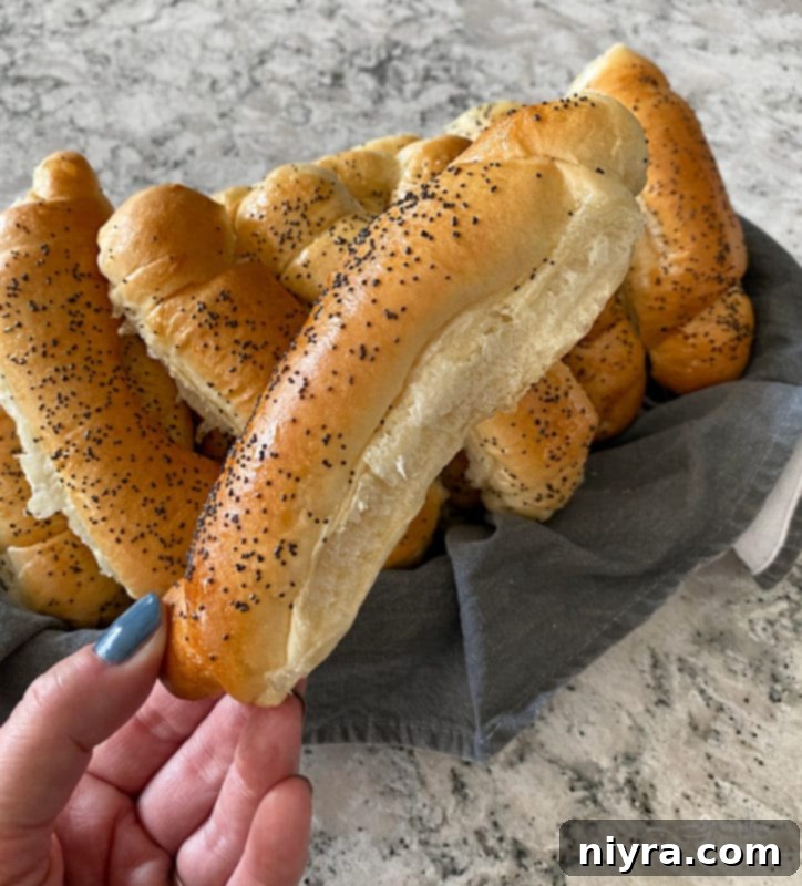 Close-up of baked poppyseed rolls on a cooling rack