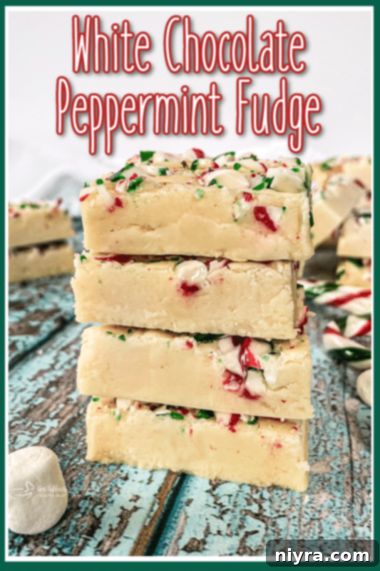 A festive holiday platter featuring White Chocolate Peppermint Fudge squares and other holiday treats.